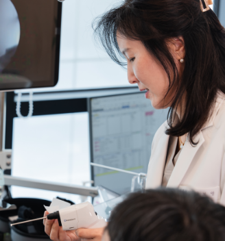 Dr. Bo-Young Kim examining a patient
